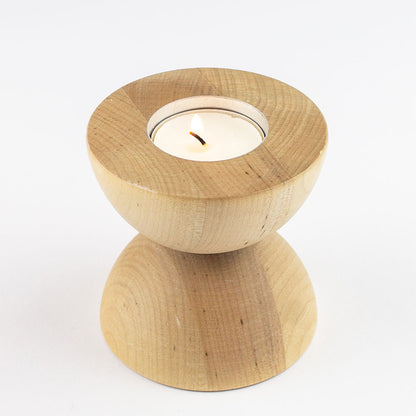 Portacandele e portalumini in legno chiaro